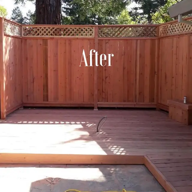 Completed redwood deck with lattice-top privacy fence and bench seating in Petaluma backyard