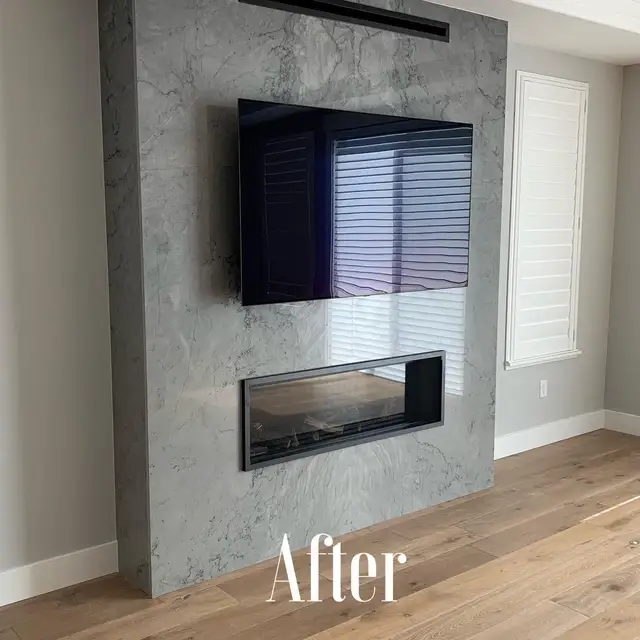 Gray quartzite fireplace surround with linear gas insert and mounted TV in a Santa Rosa remodel